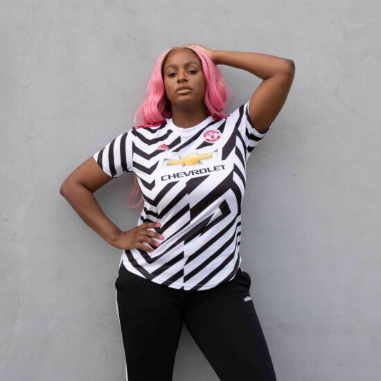 DJ Cuppy wearing the new Football Jersey