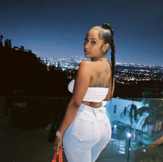 Davido steps out with another woman on vacation, causes an uproar.