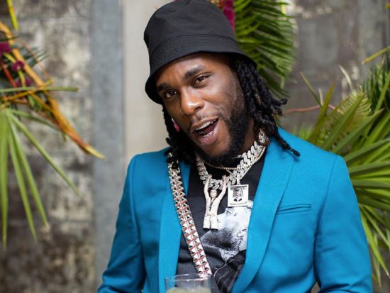 Burna Boy flaunts his Jewellery collection as he cleans them