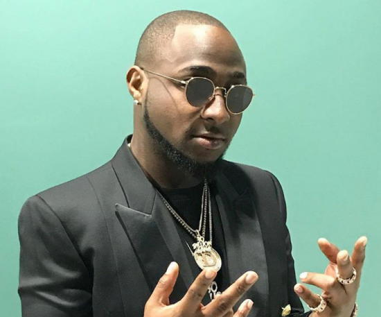 Davido splashes money on a Diamond Hand Santizer