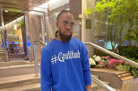 Timaya Shares Photos of New Look After Cutting Off Dreadlocks