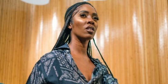 Tiwa Savage reacts as her song "Somebody's Son" causes women to cry