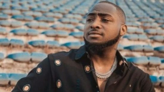 Davido narrowly escapes being taken down by a fan at an event