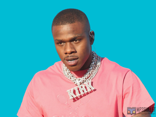 DaBaby's squad humiliates a young man who begs the rapper for money.