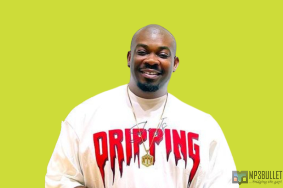 Don Jazzy reacts as a fan sketches a funny drawing of him.