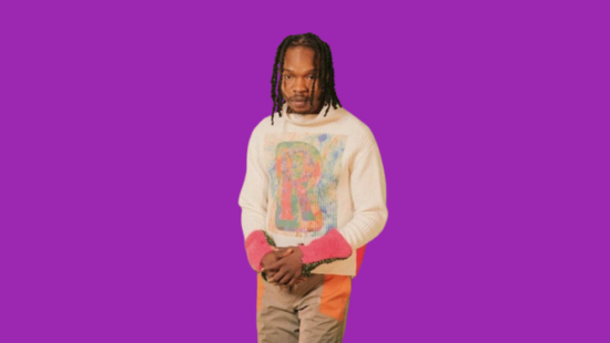 Naira Marley distributes money in front of his residence.